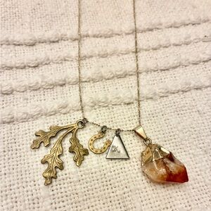 Gold Delicate Charm Necklace with Decorative Leaf and Precious Stone Pendant